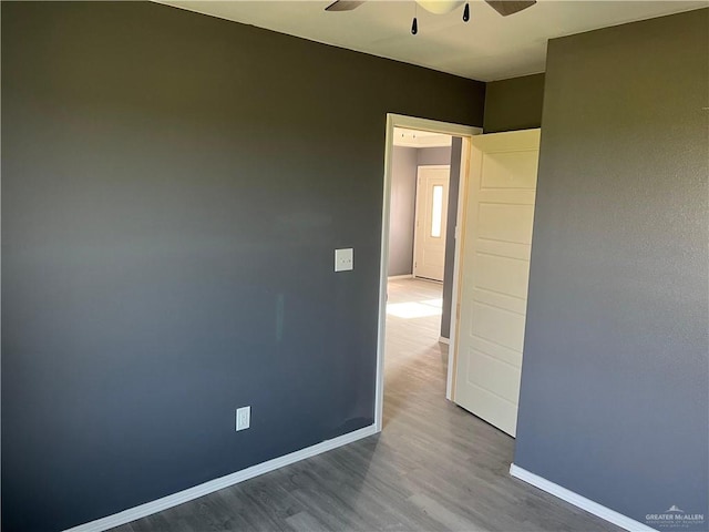 121 N Kentucky St, Mission, TX 78573 - unfurnished room with ceiling fan, wood finished floors, and baseboards