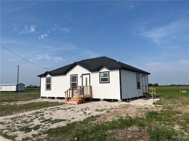 121 N Kentucky St, Mission, TX 78573 - view of front of house with roof with shingles