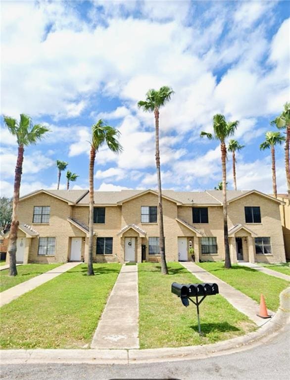 view of property featuring a front yard