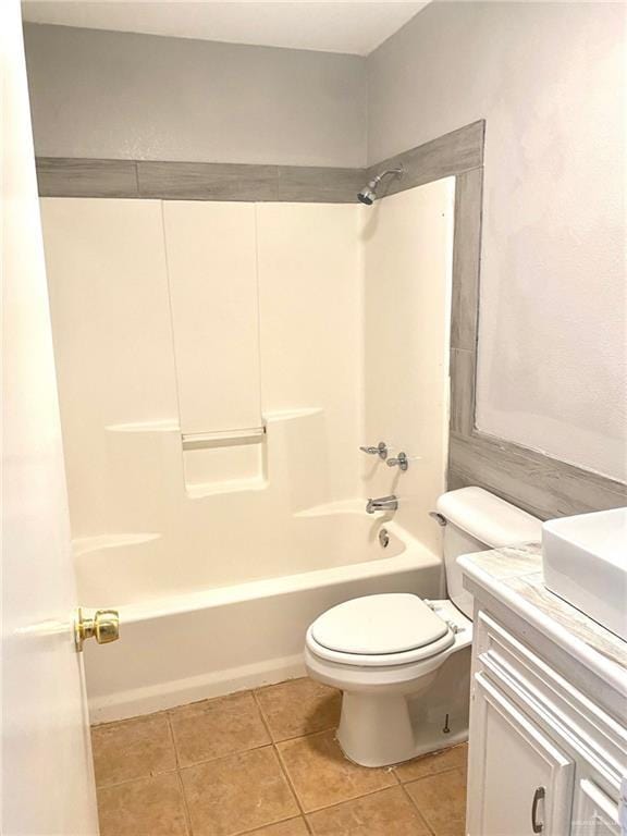 full bathroom featuring shower / bathing tub combination, vanity, tile patterned flooring, and toilet