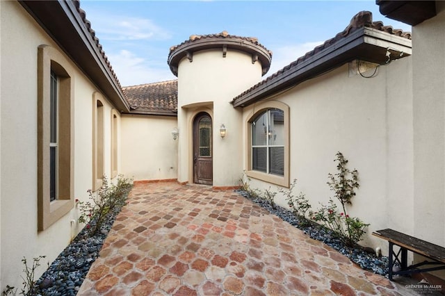 doorway to property with a patio