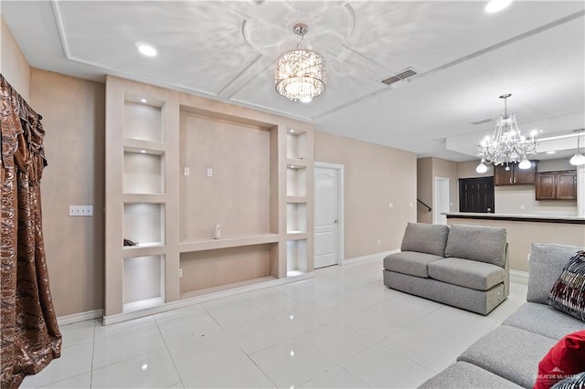 tiled living room featuring built in features and a notable chandelier