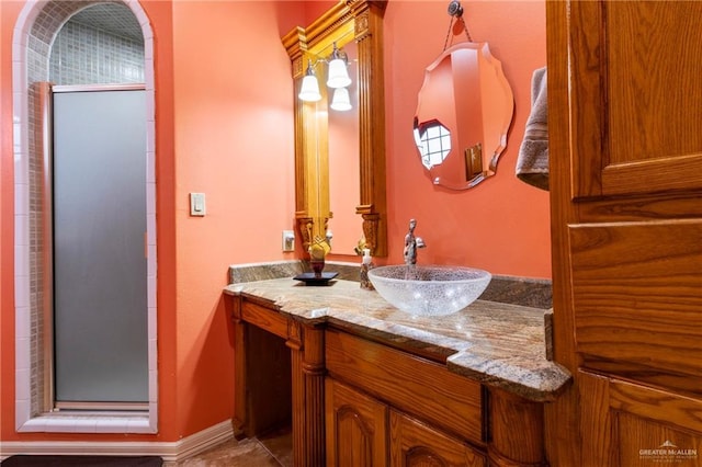 bathroom with vanity and walk in shower