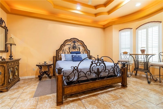 bedroom with a tray ceiling