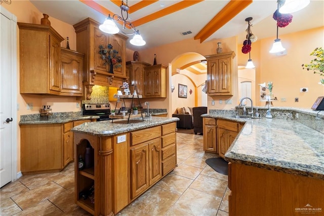 kitchen with pendant lighting, sink, a center island, stainless steel range with electric cooktop, and kitchen peninsula