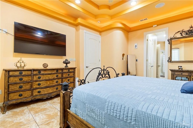 bedroom featuring a raised ceiling