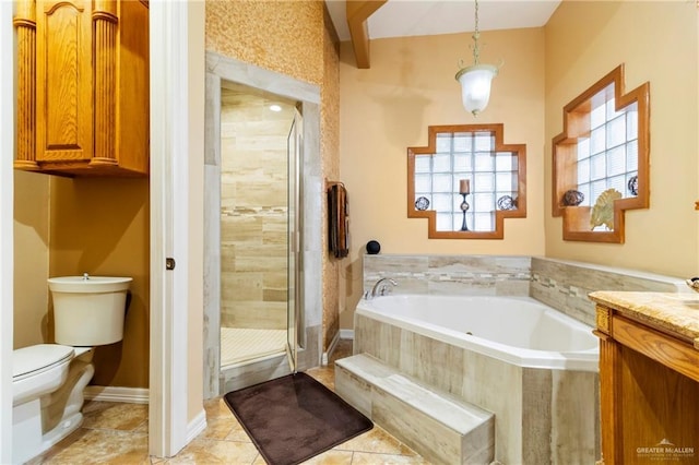 full bathroom featuring vanity, tile patterned flooring, shower with separate bathtub, and toilet