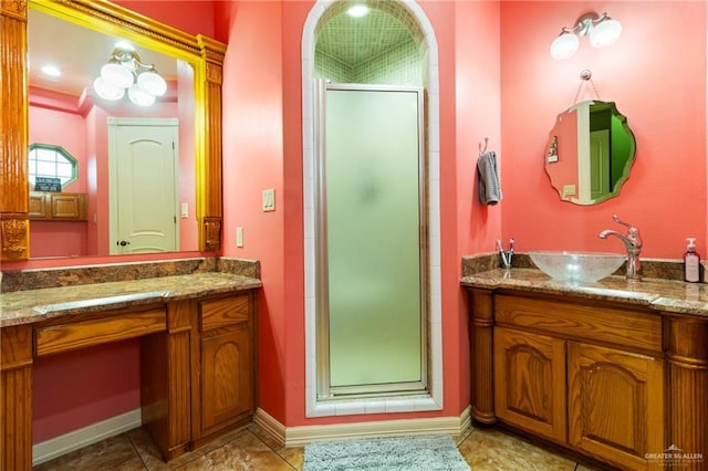 bathroom featuring an enclosed shower and vanity