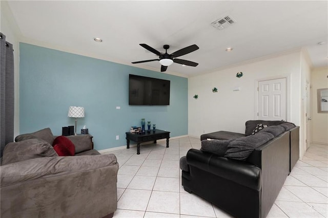 living area featuring light tile patterned flooring, crown molding, visible vents, and ceiling fan