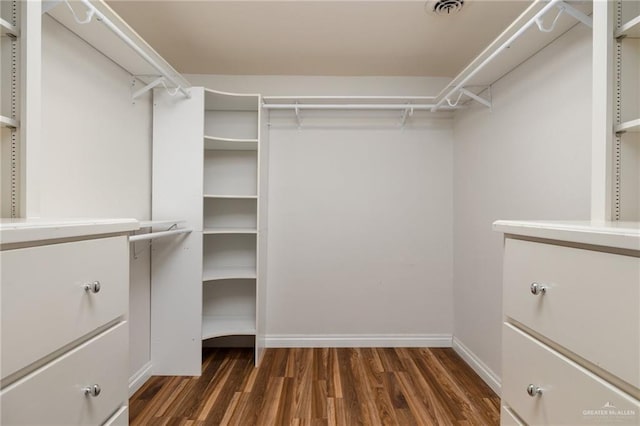 walk in closet featuring dark hardwood / wood-style flooring