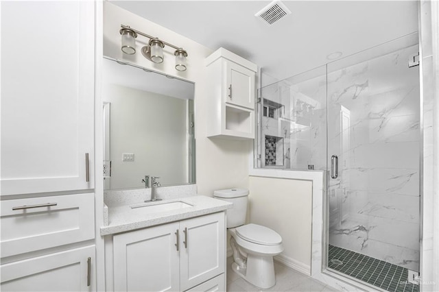 bathroom featuring vanity, an enclosed shower, and toilet