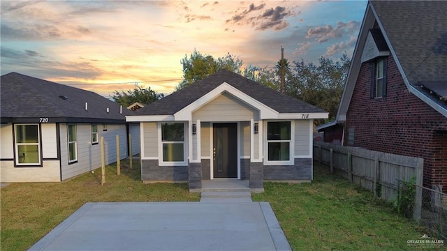 view of front of home with a yard