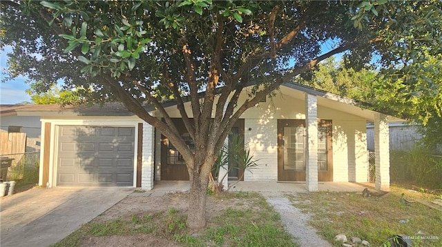 view of front of house with a porch and a garage