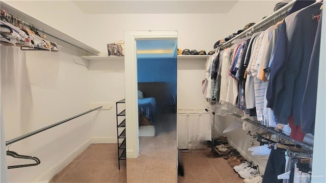 spacious closet with tile patterned flooring