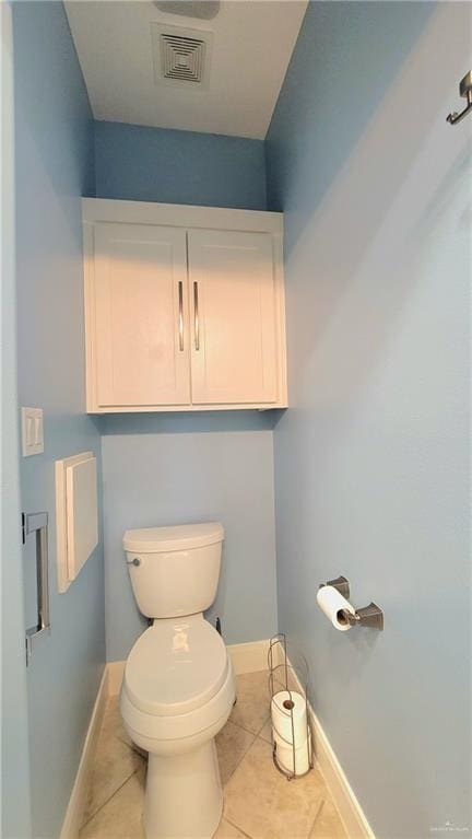 bathroom featuring tile patterned flooring and toilet