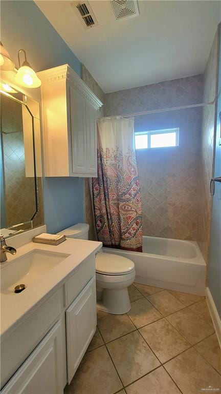 full bathroom with tile patterned floors, vanity, toilet, and shower / tub combo with curtain