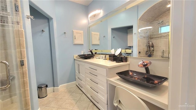 bathroom with vanity, tile patterned floors, and a shower with shower door