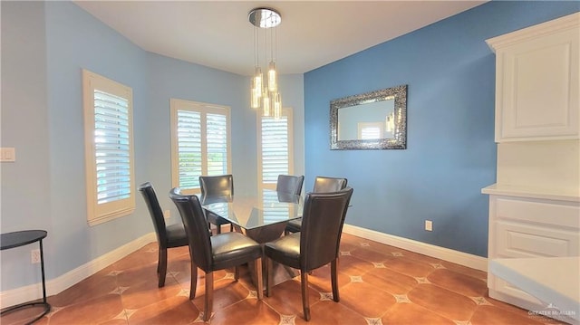 dining area with light tile patterned flooring