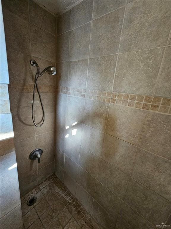 bathroom with tiled shower