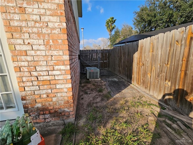 view of yard featuring central air condition unit