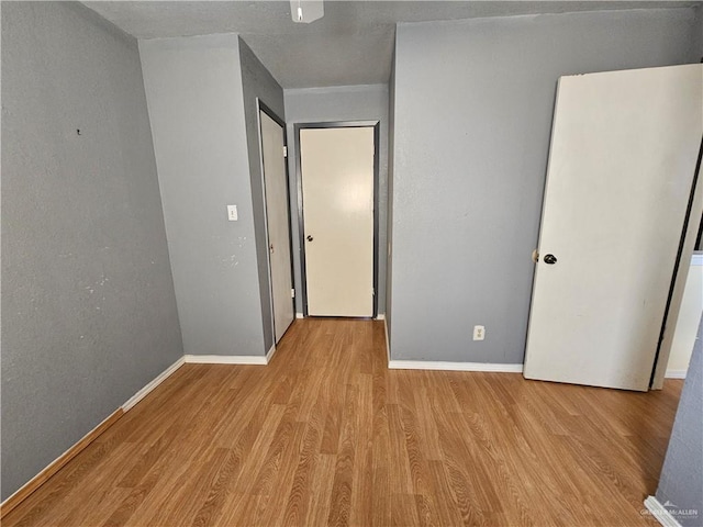 unfurnished bedroom featuring light hardwood / wood-style flooring