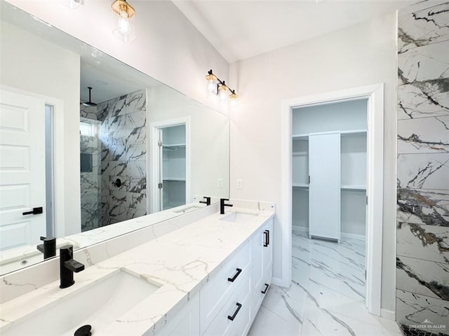 bathroom featuring vanity and a tile shower