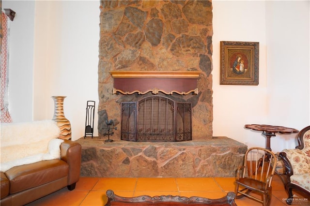 tiled living area featuring a fireplace