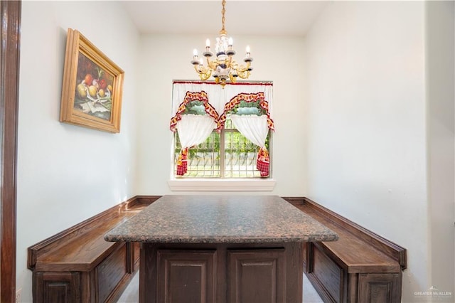 unfurnished dining area with a chandelier