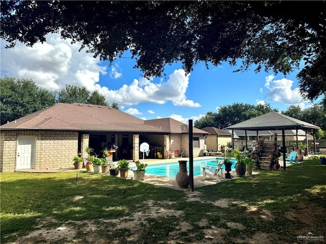 view of pool with a gazebo and a yard