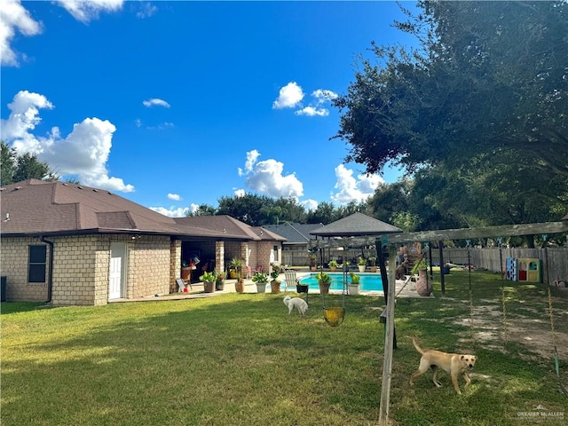 view of yard featuring a fenced in pool