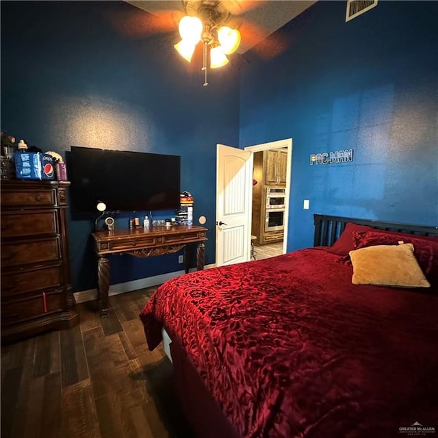 bedroom featuring ceiling fan and wood-type flooring