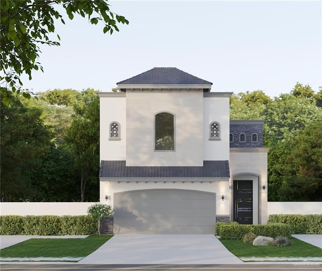 view of front of house featuring a front lawn and a garage