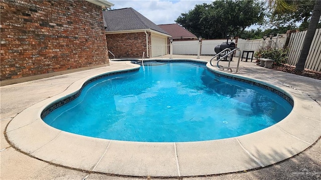 view of swimming pool featuring a patio, a fenced backyard, and a fenced in pool