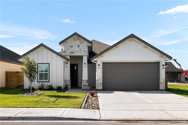 view of front of home with a garage and a front yard