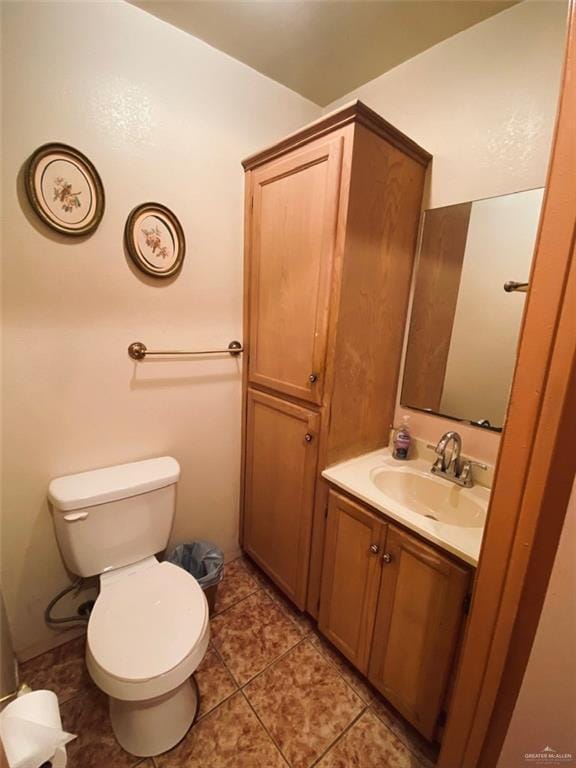 1204 E 2nd St, Weslaco, TX 78596 - half bath featuring vanity and tile patterned flooring