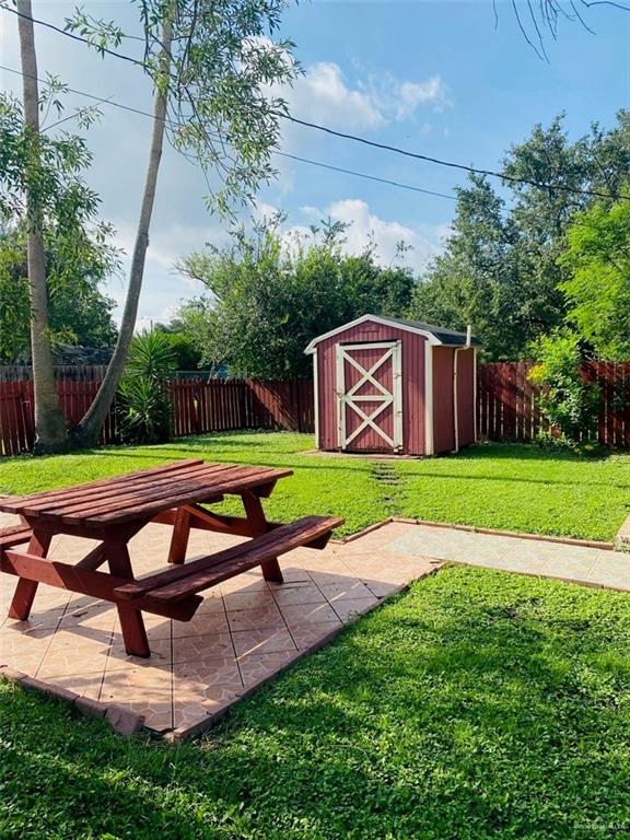 1204 E 2nd St, Weslaco, TX 78596 - fenced backyard with a shed