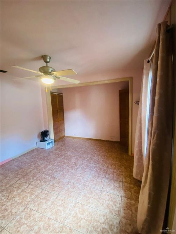 1204 E 2nd St, Weslaco, TX 78596 - unfurnished room featuring a ceiling fan and light tile patterned flooring
