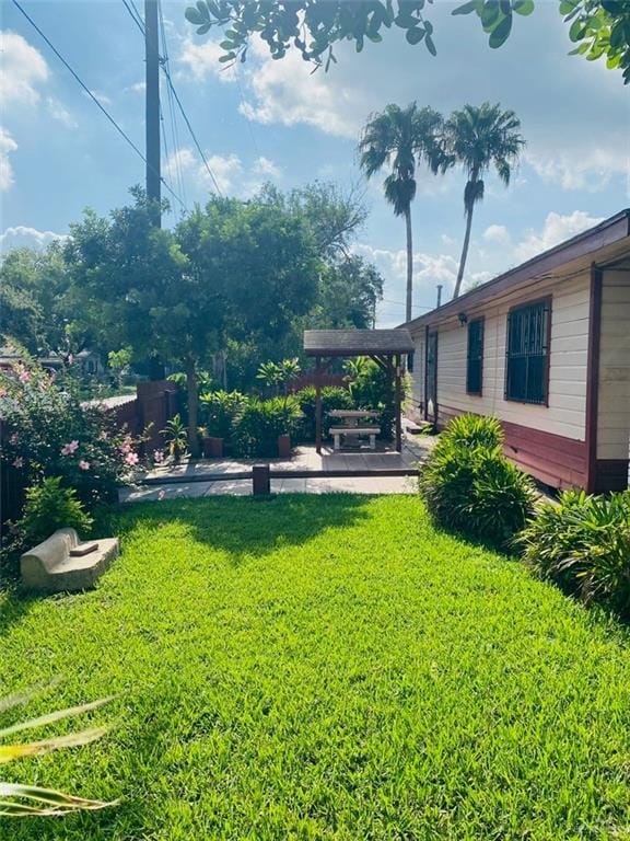 1204 E 2nd St, Weslaco, TX 78596 - view of yard with a patio area