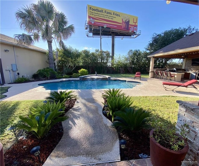 view of pool with a lawn, a patio area, an in ground hot tub, and exterior bar