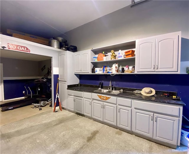 kitchen with white cabinetry and sink