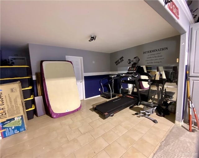 workout room with light tile patterned floors