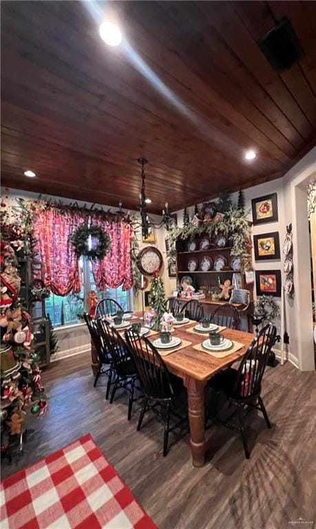 dining space featuring dark hardwood / wood-style flooring and wood ceiling