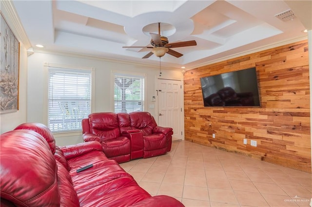 4116 N Flores St, Edinburg, TX 78541 - living area with a tray ceiling, wood walls, a ceiling fan, light tile patterned floors, and ornamental molding