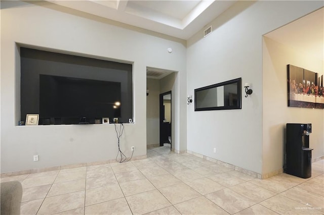 unfurnished living room with light tile patterned flooring