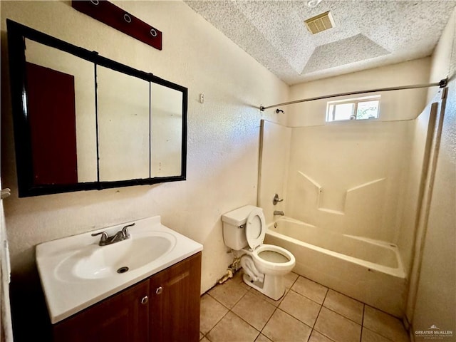 bathroom featuring tile patterned flooring, toilet, shower / tub combination, vanity, and a textured ceiling