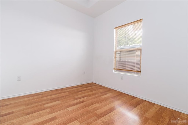 spare room featuring light hardwood / wood-style floors