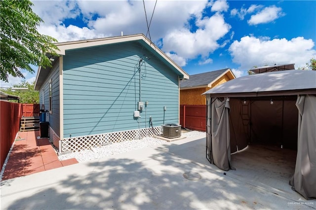 view of home's exterior featuring a patio and central AC unit