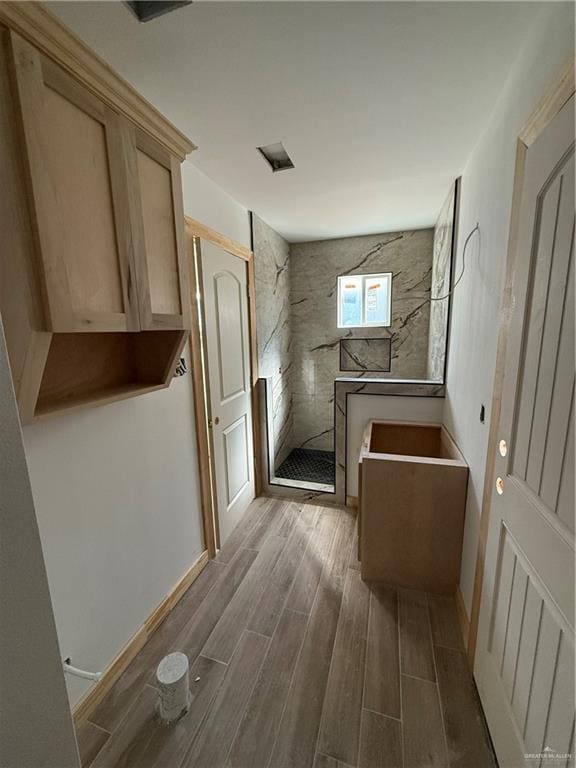 full bathroom with walk in shower and wood tiled floor