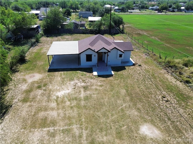 birds eye view of property with a rural view