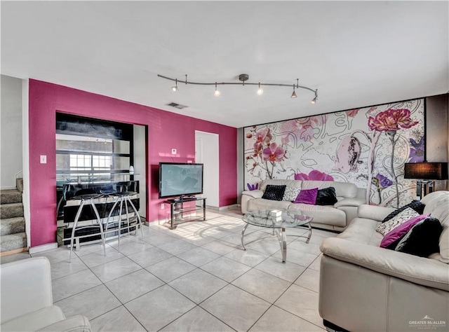 2201 S Jackson Road I Unit 7, Pharr, TX 78577 - living area with rail lighting, stairway, tile patterned flooring, and an accent wall